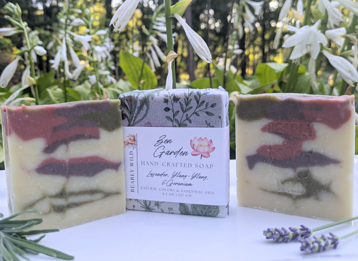 3 creme colored bars with green, pink and purple lines. 